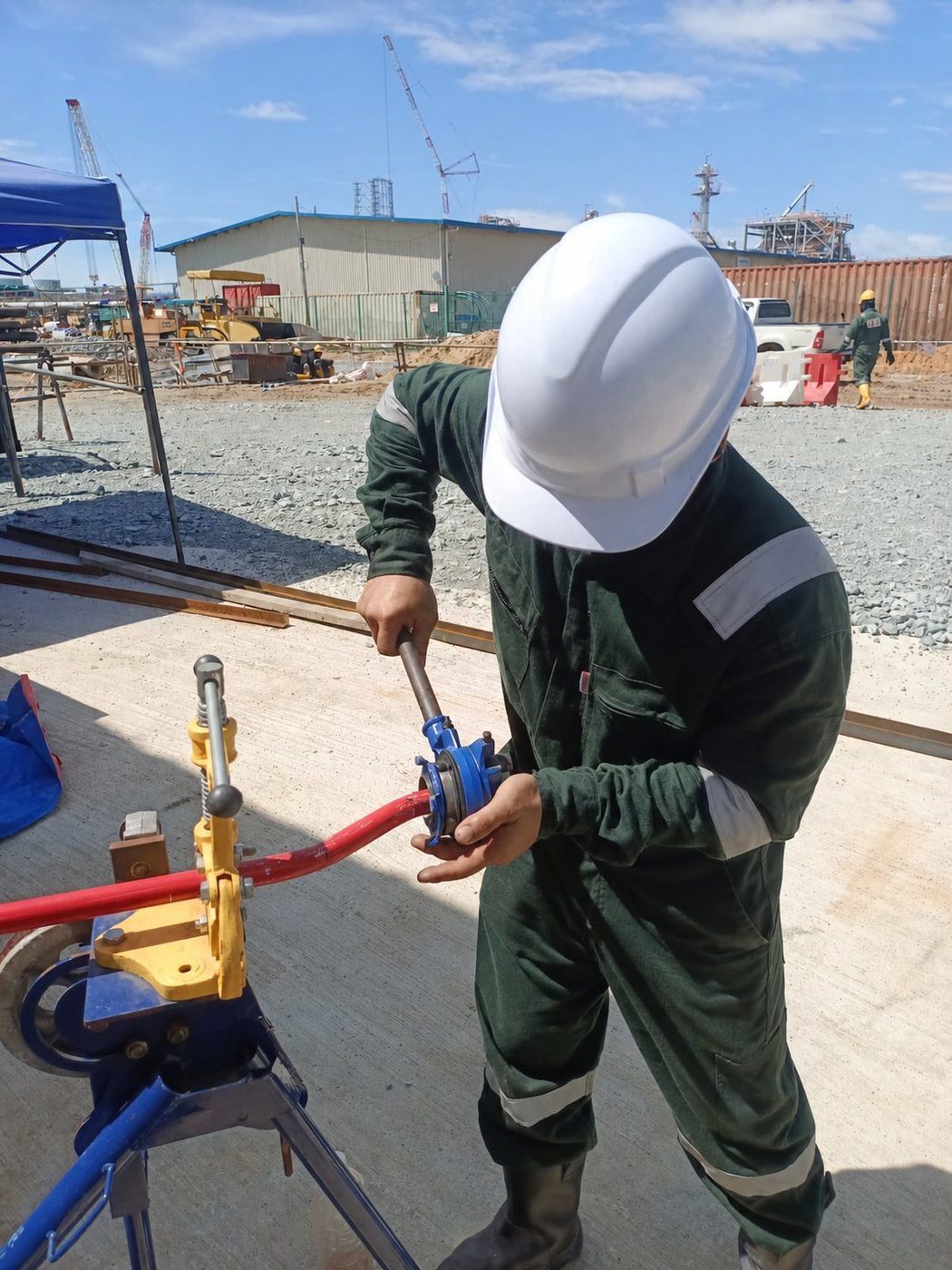Technician carrying out site fabrication work for fire suppression pipework